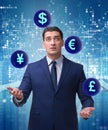 Businessman juggling between various currencies Royalty Free Stock Photo