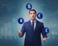 Businessman juggling between various currencies Royalty Free Stock Photo