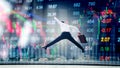Businessman jumping on digital stock market financial exchange i