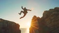 Businessman Jumping off Cliff at Sunset Royalty Free Stock Photo