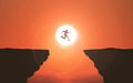 Businessman Jumping Over Cliff Sunset background Silhouette. Brave Young Man Jumps between 2 Cliffs In Front Of The Sun. Business Royalty Free Stock Photo