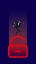 Businessman jumping over giant neon colored lock symbolizing data security. Creative conceptual design.