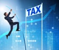 Businessman jumping over tax in tax evasion avoidance concept Royalty Free Stock Photo