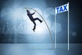 The businessman jumping over tax in tax evasion avoidance concept Royalty Free Stock Photo