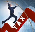 Businessman jumping over tax in tax evasion avoidance concept Royalty Free Stock Photo