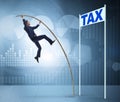 Businessman jumping over tax in tax evasion avoidance concept Royalty Free Stock Photo