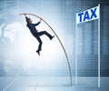 Businessman jumping over tax in tax evasion avoidance concept Royalty Free Stock Photo