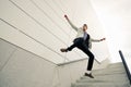 Businessman jumping, wearing jacket and shirt