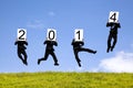 Businessman jumping with 2014 year