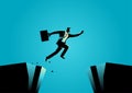 Businessman jumps over the ravine