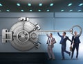 Businessman with key near bank vault door Royalty Free Stock Photo