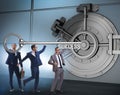 Businessman with key near bank vault door Royalty Free Stock Photo