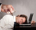 Businessman with a key winder on his back Royalty Free Stock Photo