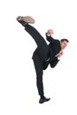 Businessman Kicking Over White Background