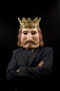 Businessman with king mask and crossed arms Royalty Free Stock Photo