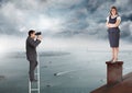 Businessman on ladder looking at Businesswoman standing on Roof with chimney and cloudy city port Royalty Free Stock Photo