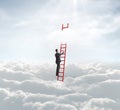 Businessman on ladder