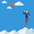 Businessman on a ladder.