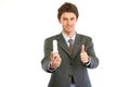 Businessman with lamp showing thumbs up Royalty Free Stock Photo