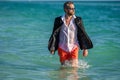businessman with laptop in formal wear near tropical beach. Hot business summer. business boss spending weekend at the