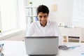 Businessman with laptop and papers at office Royalty Free Stock Photo