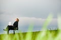 Businessman with laptop relaxing outdoors Royalty Free Stock Photo