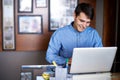 Businessman, laptop and typing in workplace professional, salesman and working in office. Male person, smile and happy Royalty Free Stock Photo