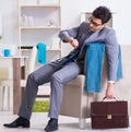 The businessman late for office due to oversleeping after overni Royalty Free Stock Photo