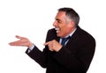 Businessman laughing and pointing extended hand