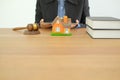 businessman lawyer with law book judge gavel & house model. buying selling renting real estate property