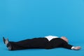 Businessman laying on floor