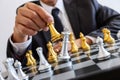 Businessman leadership playing chess and thinking strategy plan