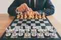 Businessman leadership playing chess and thinking strategy plan about crash overthrow the opposite team and development analyze