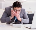 Businessman leaking confidential information over phone Royalty Free Stock Photo