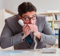 Businessman leaking confidential information over phone Royalty Free Stock Photo