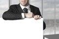 Businessman leaning on blank sign Royalty Free Stock Photo