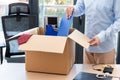 businessman leaving work putting his belongings in a box Royalty Free Stock Photo