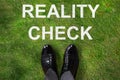 Person Standing Next To Reality Check Text Royalty Free Stock Photo
