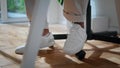 Businessman legs sitting chair closeup. Modern freelancer dancing feet working