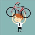 Businessman lift up red and black bicycle for go to exercise aft