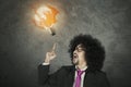 Businessman with light bulb on fire Royalty Free Stock Photo