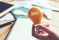 Businessman with lightbulb on desk in workplace.Ideas,creativity,inspiration concept Royalty Free Stock Photo