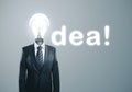 Businessman with lightbulb instead of a head Royalty Free Stock Photo