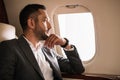 Businessman looking at airplane window Royalty Free Stock Photo