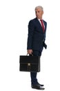 Businessman looking back over shoulder and holding a briefcase Royalty Free Stock Photo