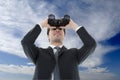 Businessman looking through binoculars Royalty Free Stock Photo