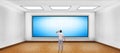 Businessman looking at blank plasma tv Royalty Free Stock Photo