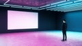 Businessman looking at white mock up poster on dark wall in modern empty hall with neon paints Royalty Free Stock Photo
