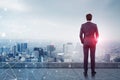 Businessman looking at city, network