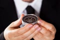 Businessman looking at a compass